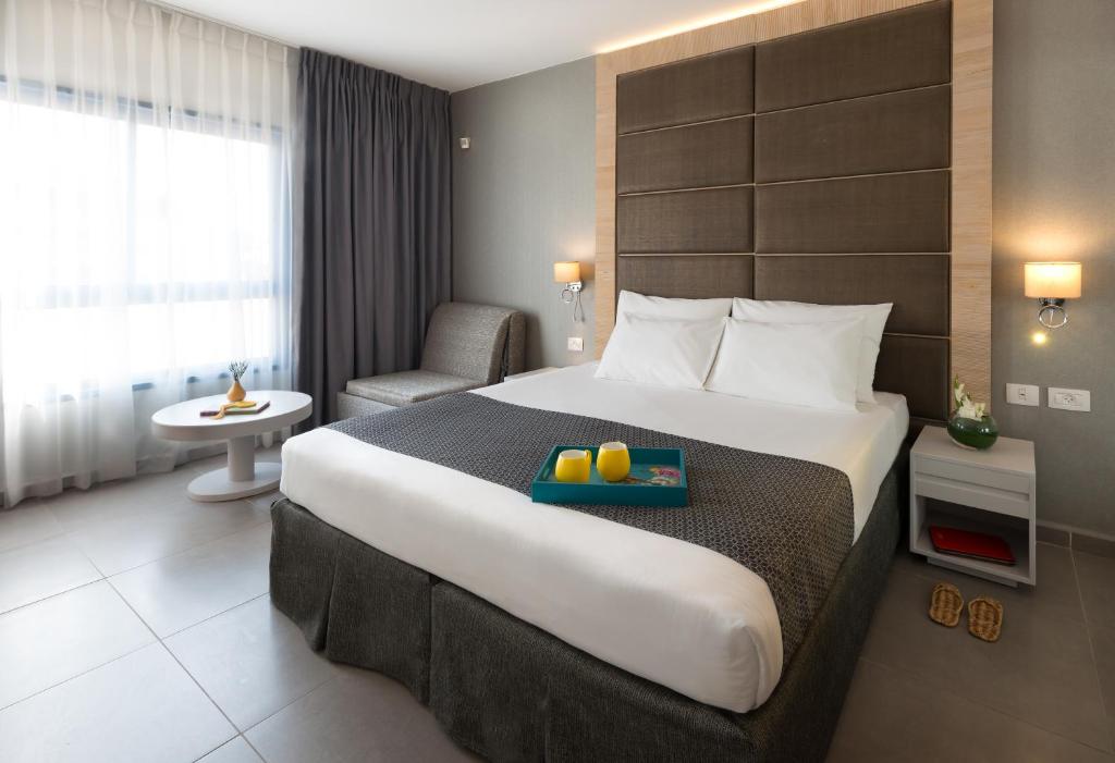 Ein Bett oder Betten in einem Zimmer der Unterkunft Hotel Astral Nirvana Club- Half Board