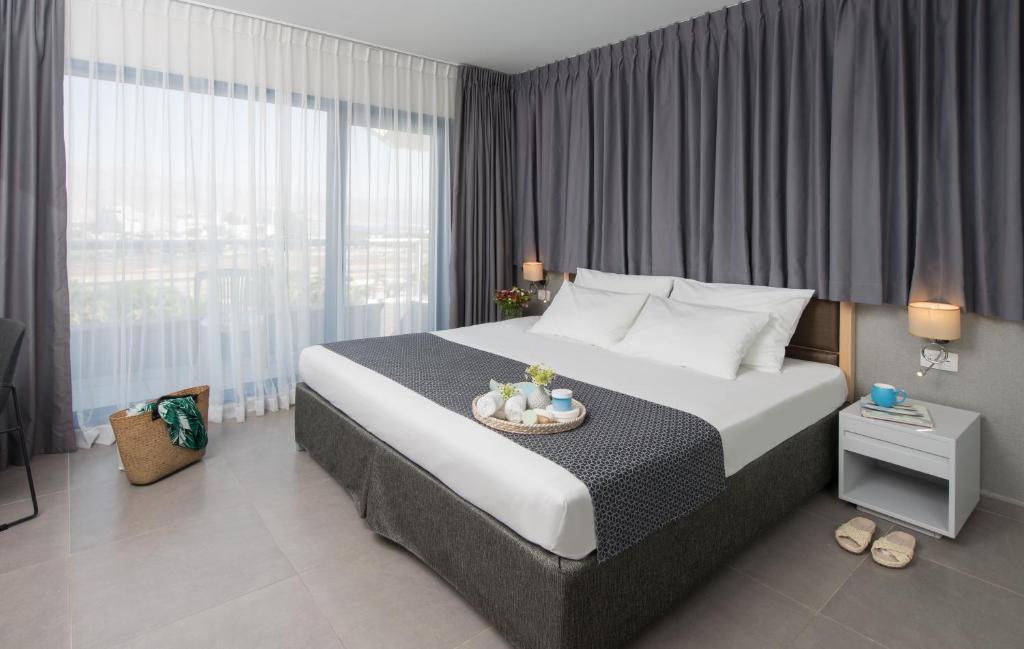 Ein Bett oder Betten in einem Zimmer der Unterkunft Hotel Astral Nirvana Club- Half Board