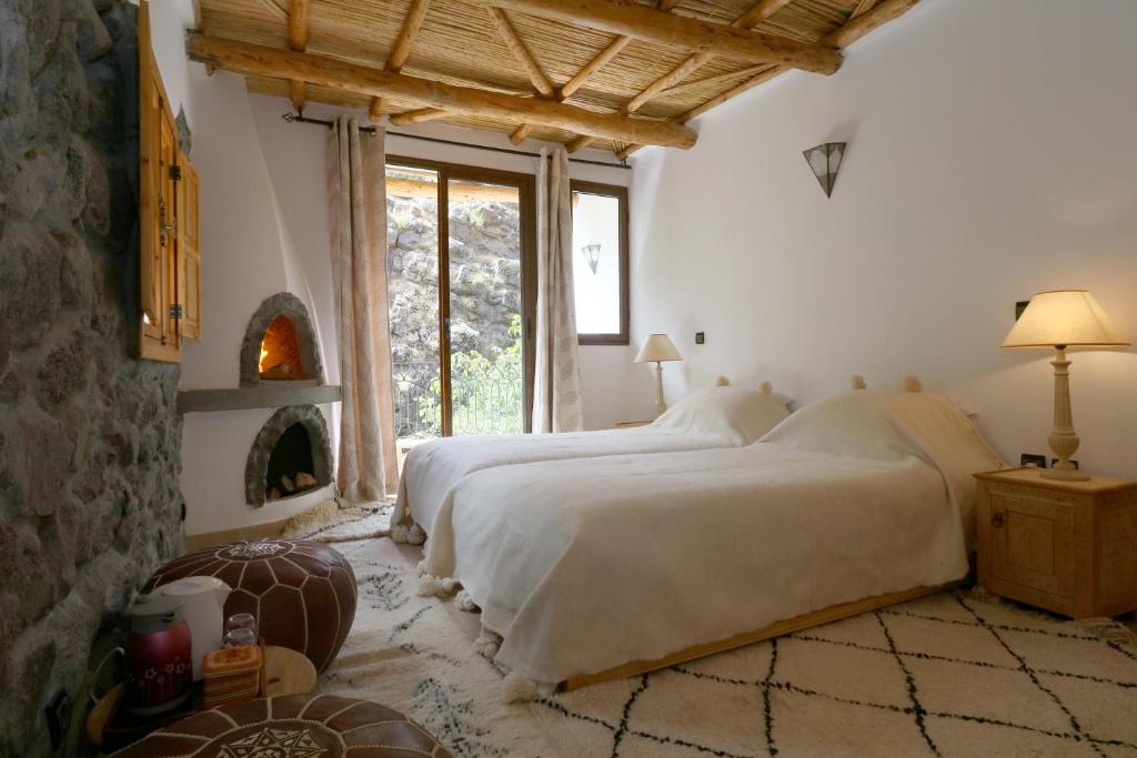 Postel nebo postele na pokoji v ubytování Hiba Lodge