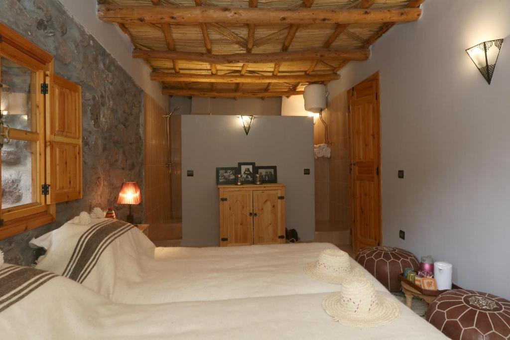 Postel nebo postele na pokoji v ubytování Hiba Lodge