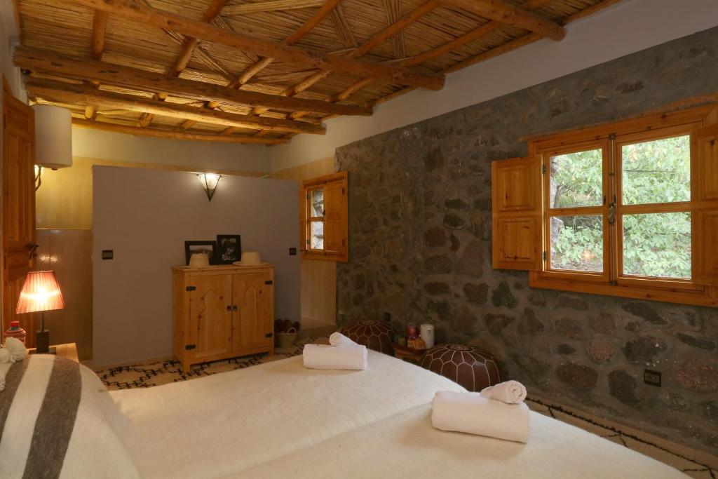 Postel nebo postele na pokoji v ubytování Hiba Lodge