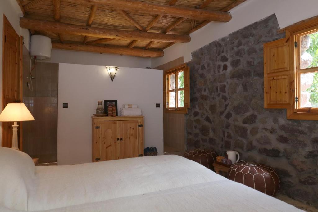 Postel nebo postele na pokoji v ubytování Hiba Lodge
