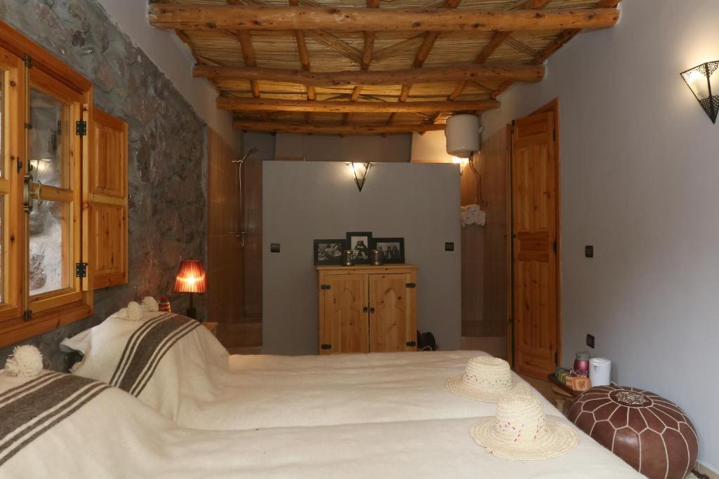 Postel nebo postele na pokoji v ubytování Hiba Lodge