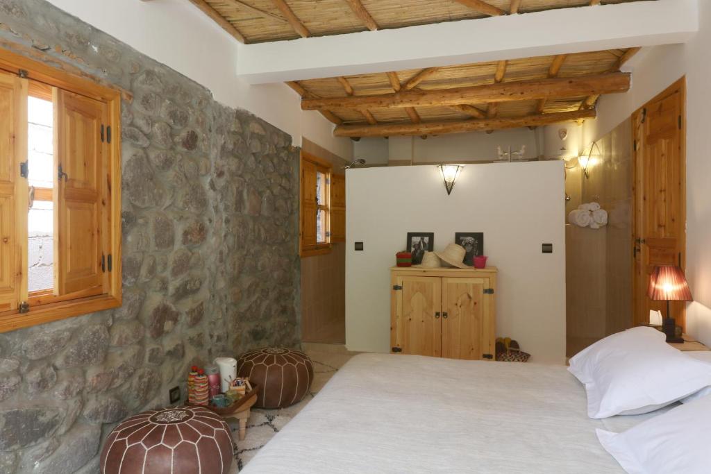 Postel nebo postele na pokoji v ubytování Hiba Lodge