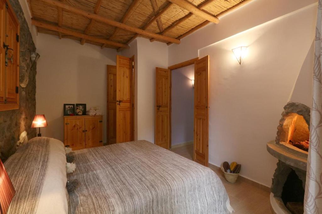 Postel nebo postele na pokoji v ubytování Hiba Lodge