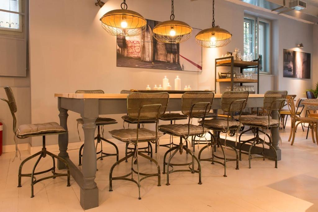 a dining room with a table and chairs at Smokvica Dorćol B&B in Belgrade