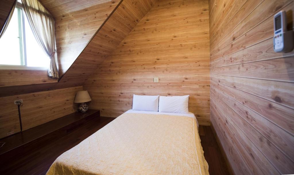 Postel nebo postele na pokoji v ubytování Songyuan B&B