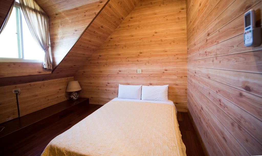 Postel nebo postele na pokoji v ubytování Songyuan B&B