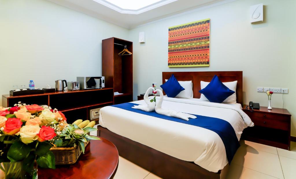 Katil atau katil-katil dalam bilik di Tanzanite Executive Suites