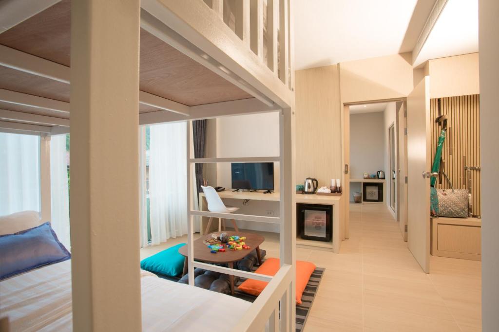 Postel nebo postele na pokoji v ubytování LaRio Hotel Krabi-SHA Extra Plus