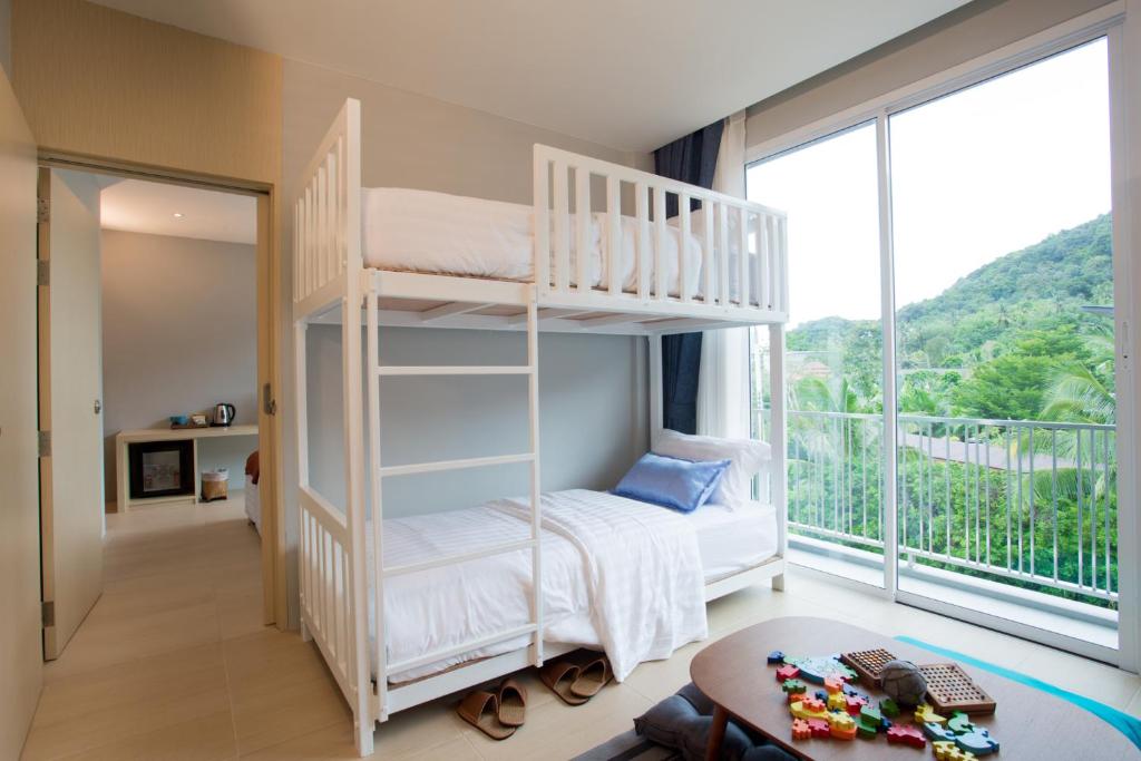 Postel nebo postele na pokoji v ubytování LaRio Hotel Krabi-SHA Extra Plus