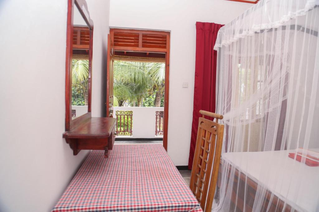 Balkón nebo terasa v ubytování Tithira Guest House