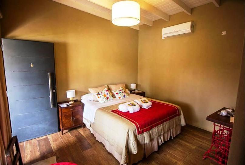 Säng eller sängar i ett rum på Tierra Mansa - Posada de Campo & Spa - Piscina Climatizada