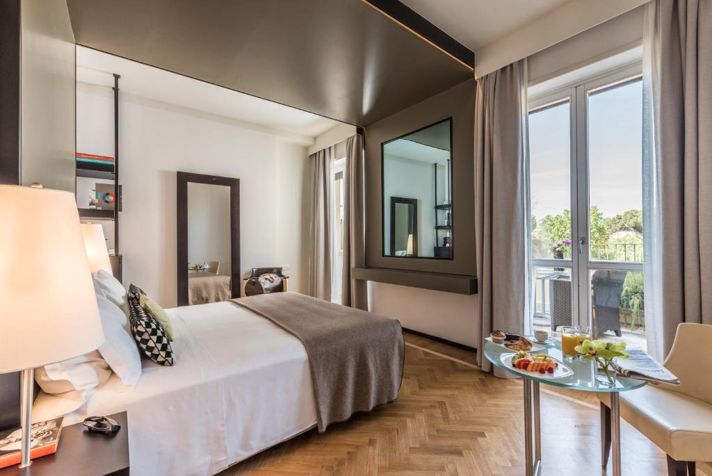 A bed or beds in a room at 47 Boutique Hotel