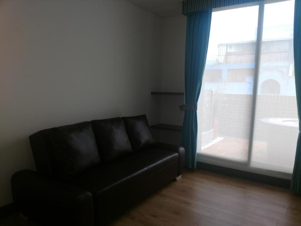Posezení v ubytování De Película Hotel