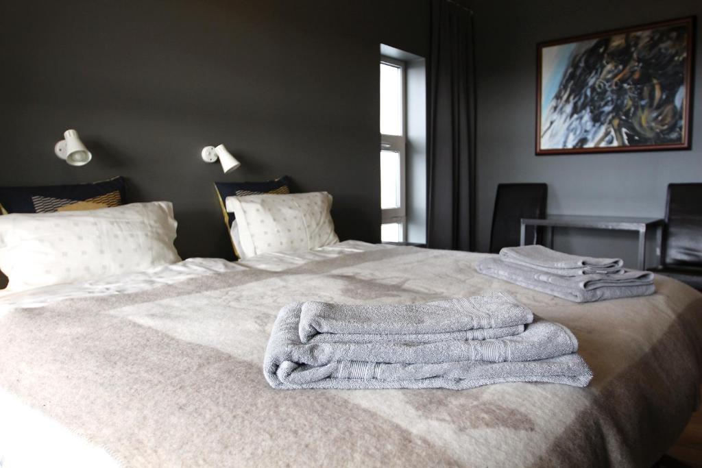 Postel nebo postele na pokoji v ubytování Ármót Guesthouse