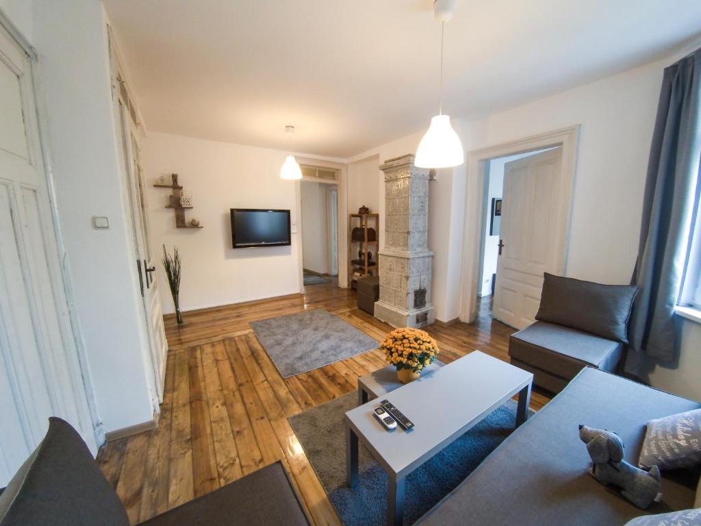 TV a/nebo společenská místnost v ubytování Graf Ignatiev - 3BR APART