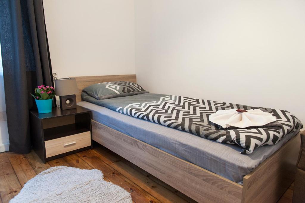 Postel nebo postele na pokoji v ubytování Graf Ignatiev - 3BR APART