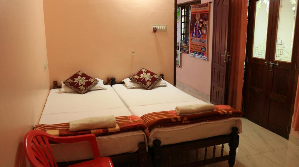Postel nebo postele na pokoji v ubytování Chackalakkal Home Stay