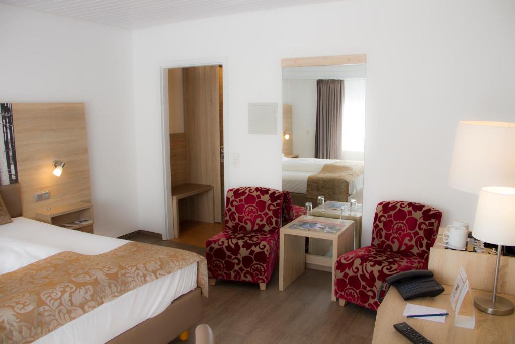 Postel nebo postele na pokoji v ubytování Best Western Plus Schwarzwald Residenz