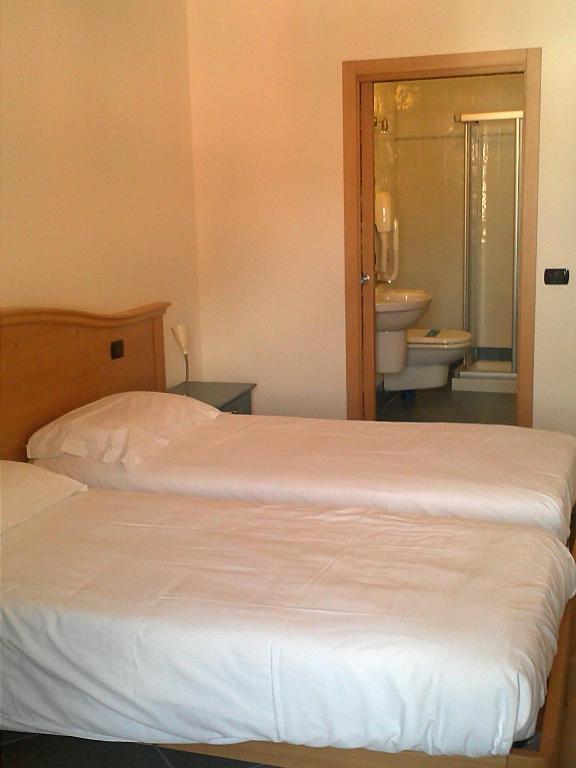 Postel nebo postele na pokoji v ubytování Residence Centrale