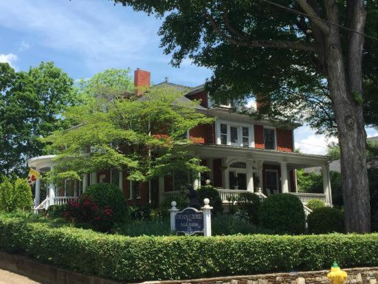 a house with a sign in front of it at Chestnut Street Inn in Asheville