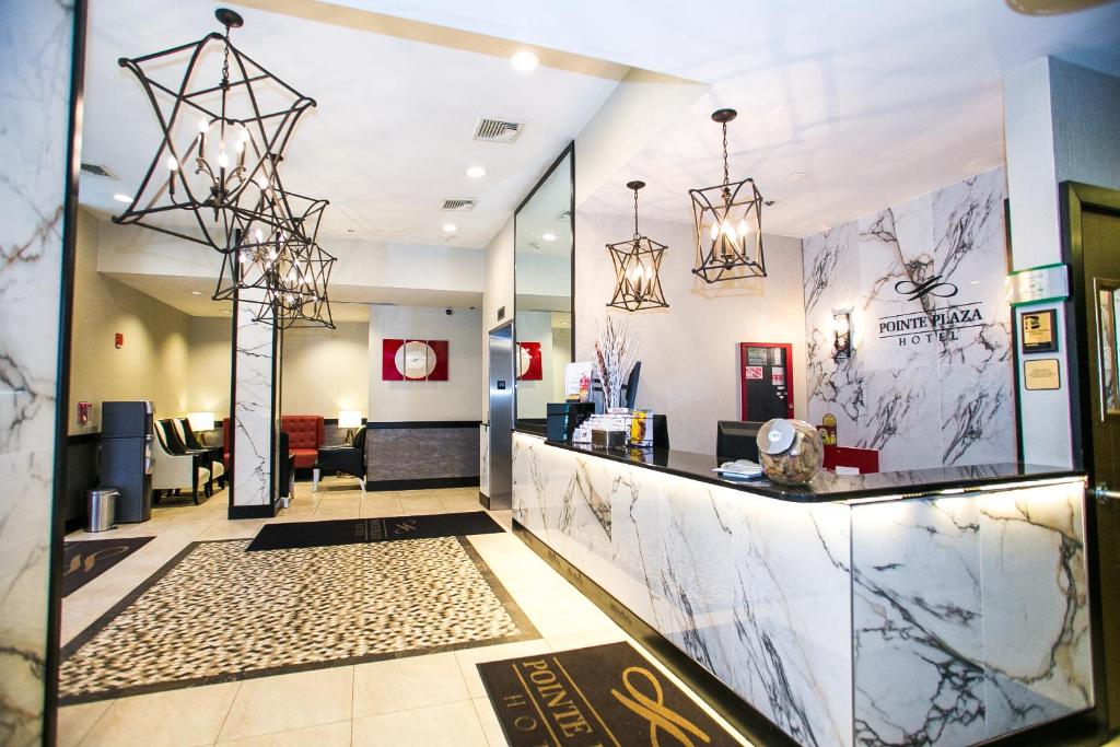 a lobby of a store with a reception counter at Pointe Plaza Hotel in Brooklyn