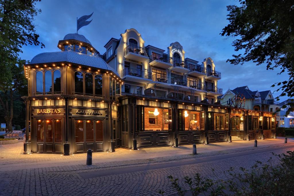 a large building with lights on it at night at Europa Hotel Kühlungsborn in Kühlungsborn