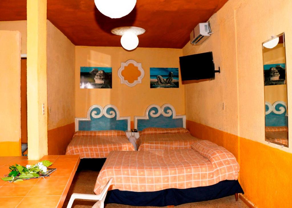 TV a/nebo společenská místnost v ubytování Hotel Suites Elia Noemi