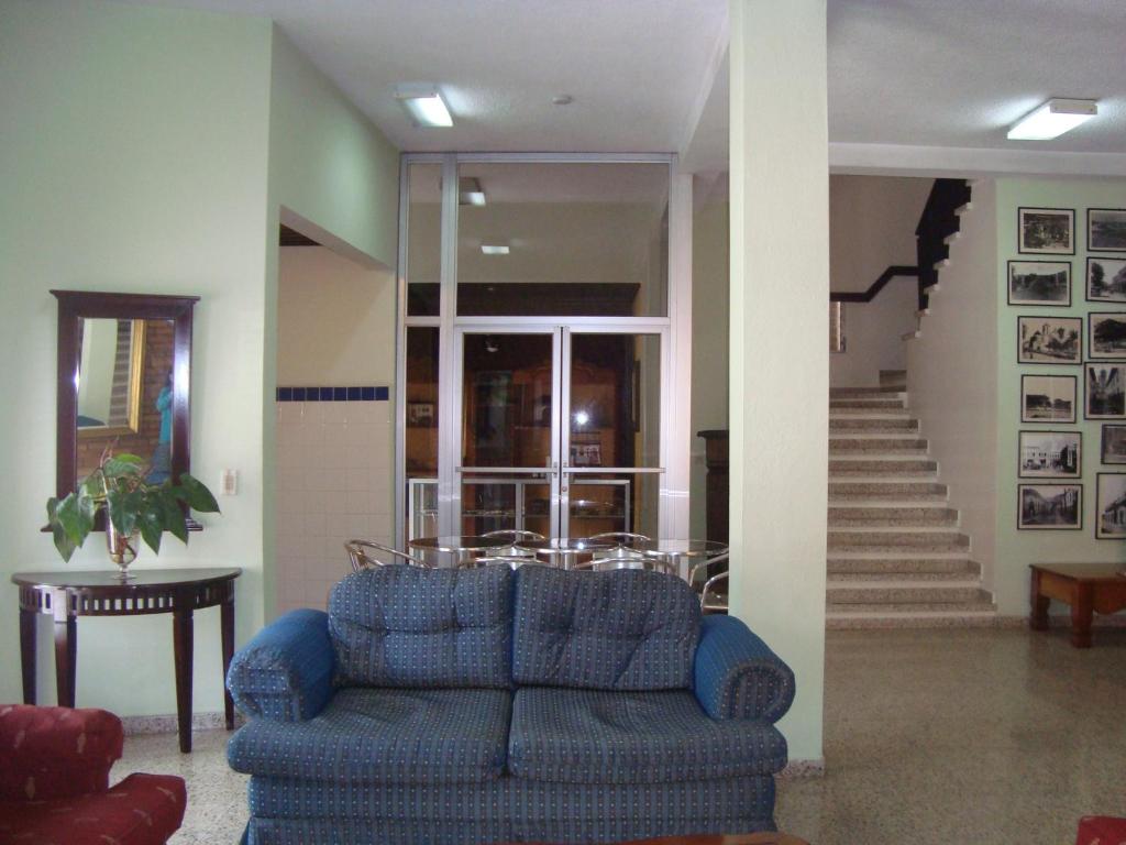 Χώρος καθιστικού στο Hotel Mac Arthur