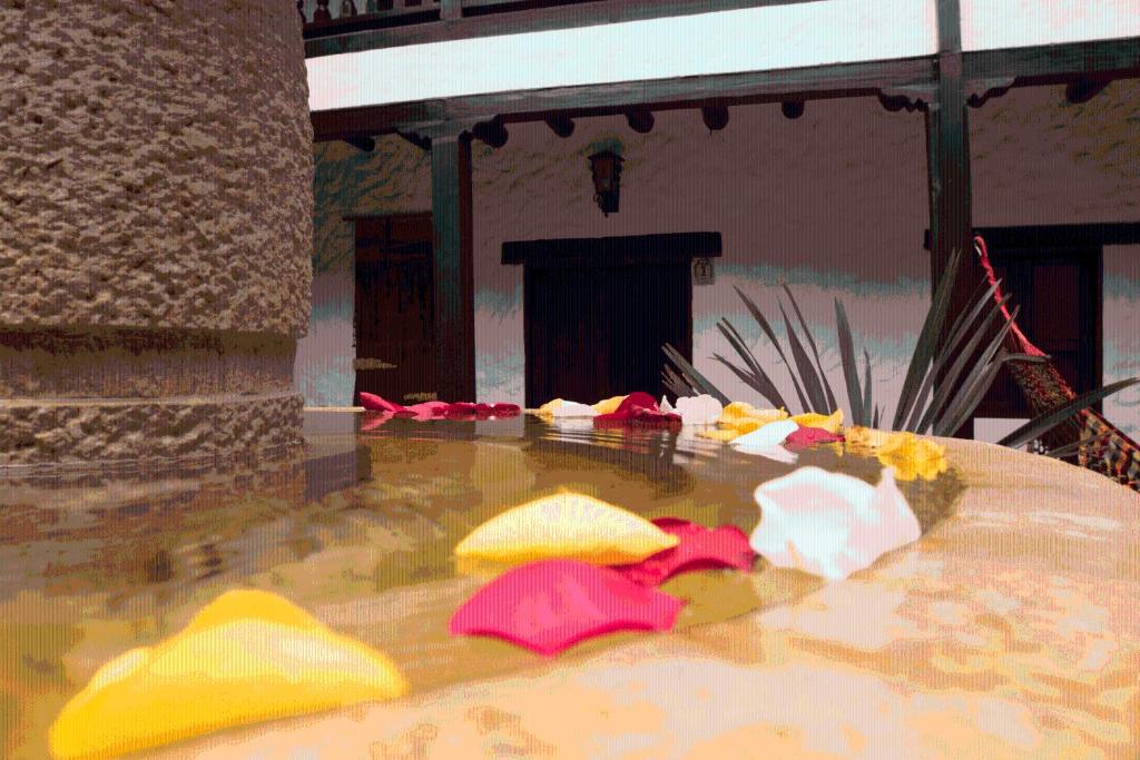 a table with yellow and red items on it at Casona Quesada in Suesca