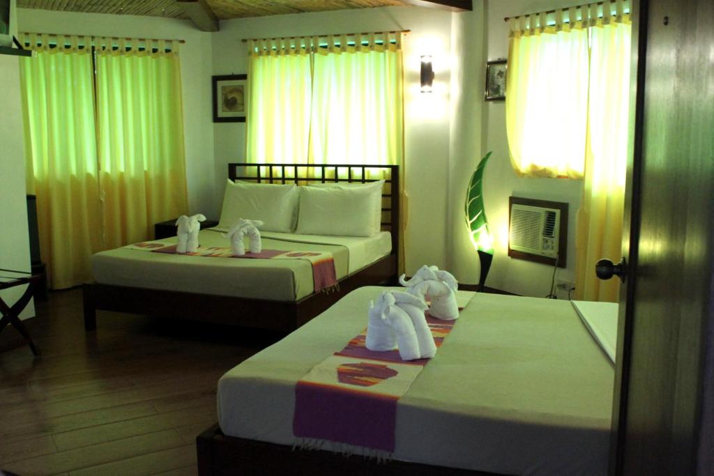 Postel nebo postele na pokoji v ubytování Coron Hilltop View Resort