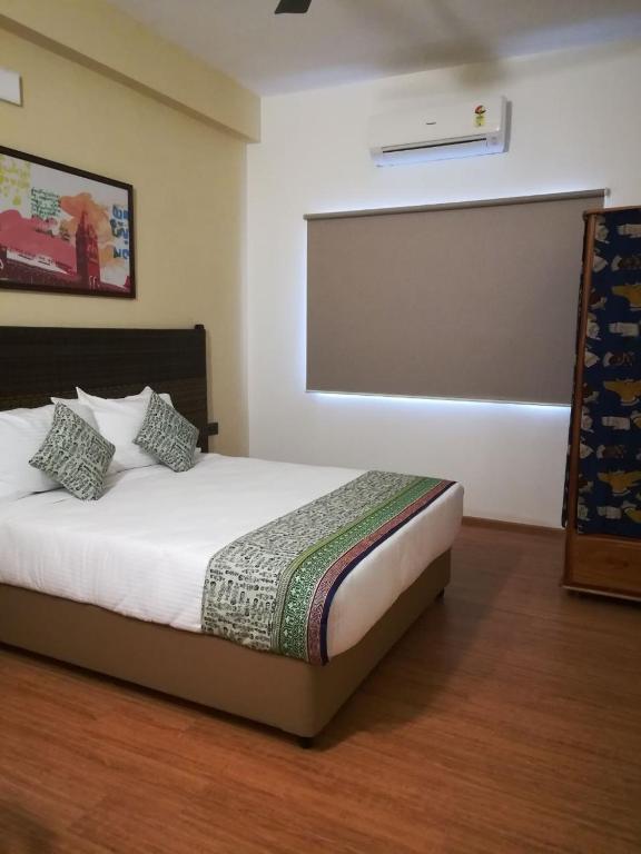 Postel nebo postele na pokoji v ubytování Hotel Beebiz Guindy