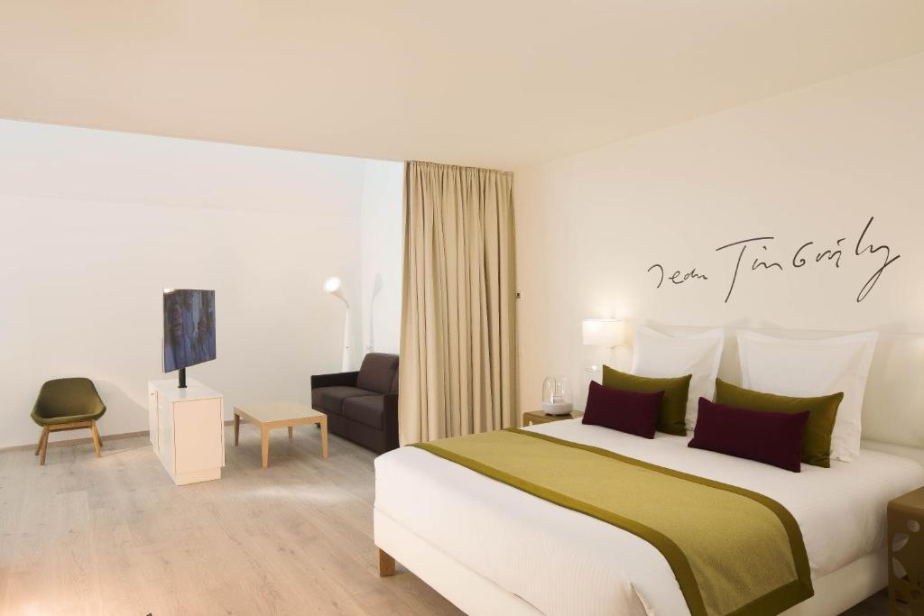 A bed or beds in a room at The Passage - Urban Retreat
