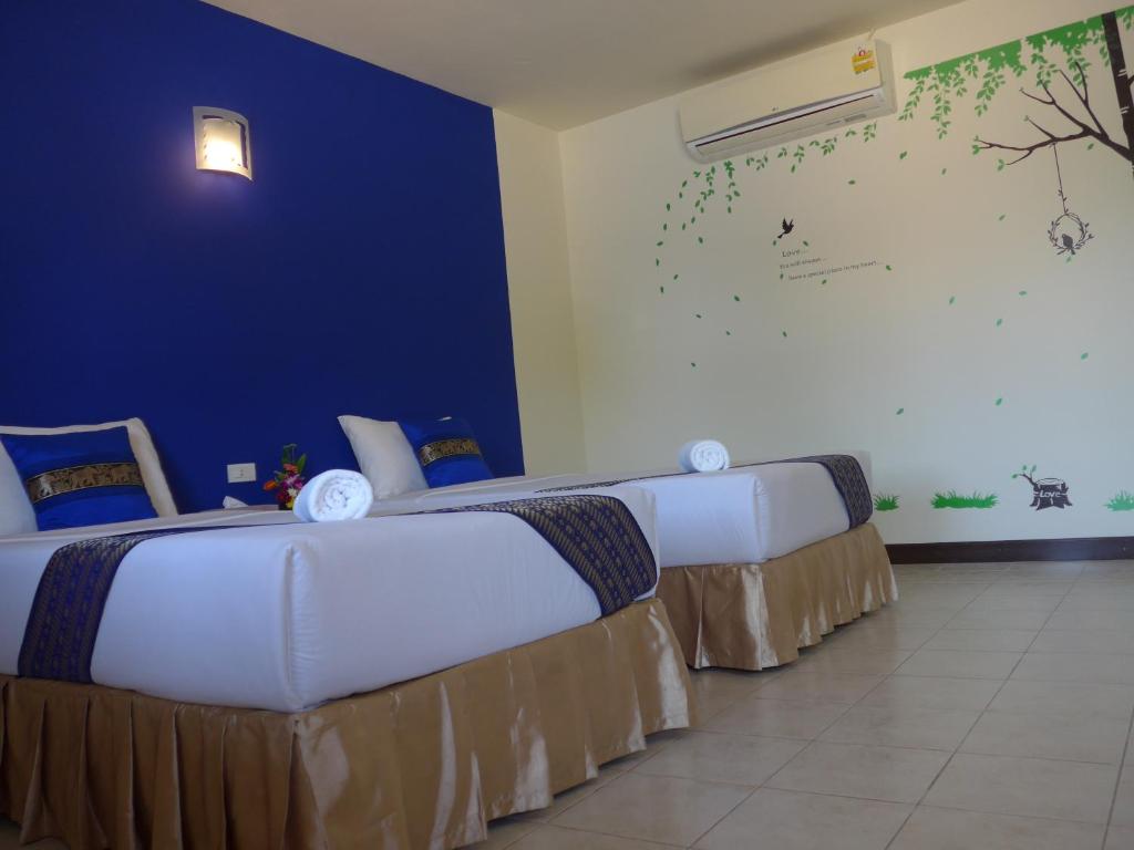 Postel nebo postele na pokoji v ubytování Forum House Hotel Krabi