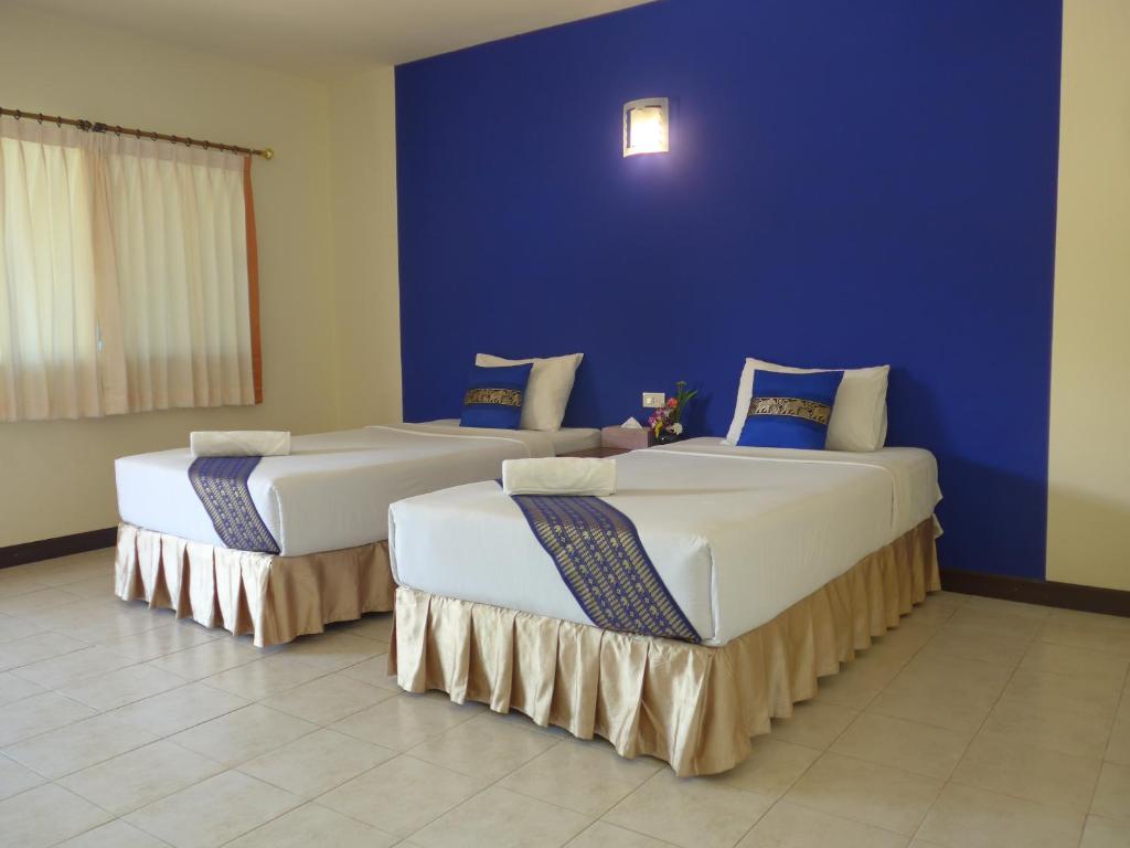 Postel nebo postele na pokoji v ubytování Forum House Hotel Krabi