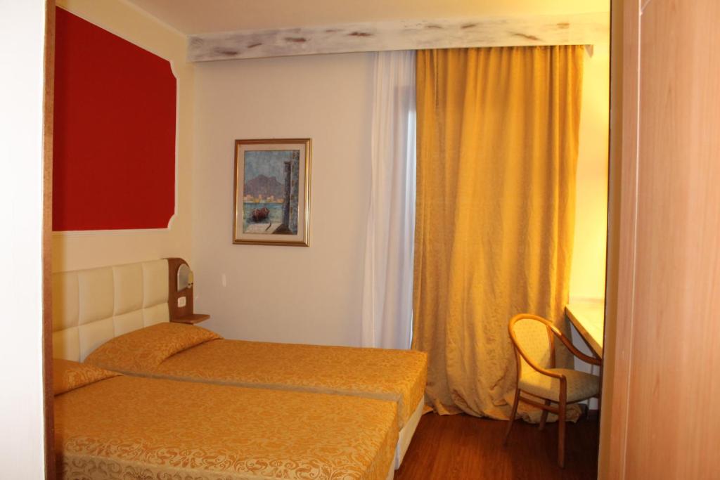 Postel nebo postele na pokoji v ubytování Hotel Delta Florence