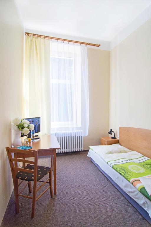 Postel nebo postele na pokoji v ubytování Hotel Hůrka