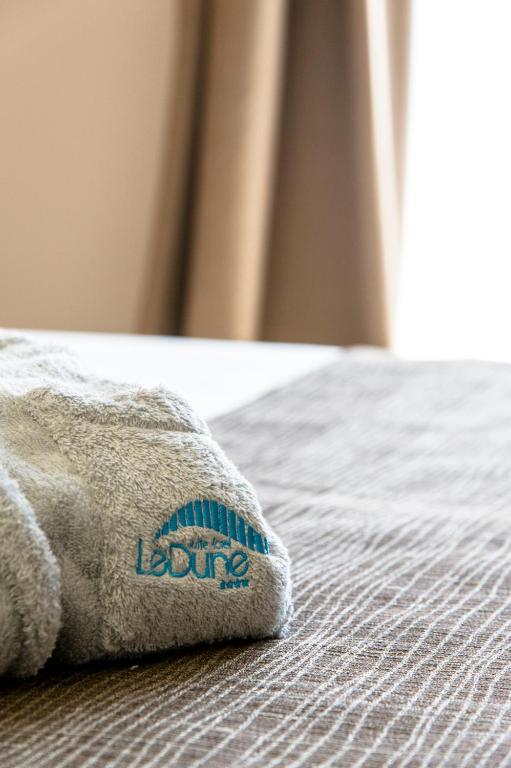 Posteľ alebo postele v izbe v ubytovaní Le Dune Suite Hotel