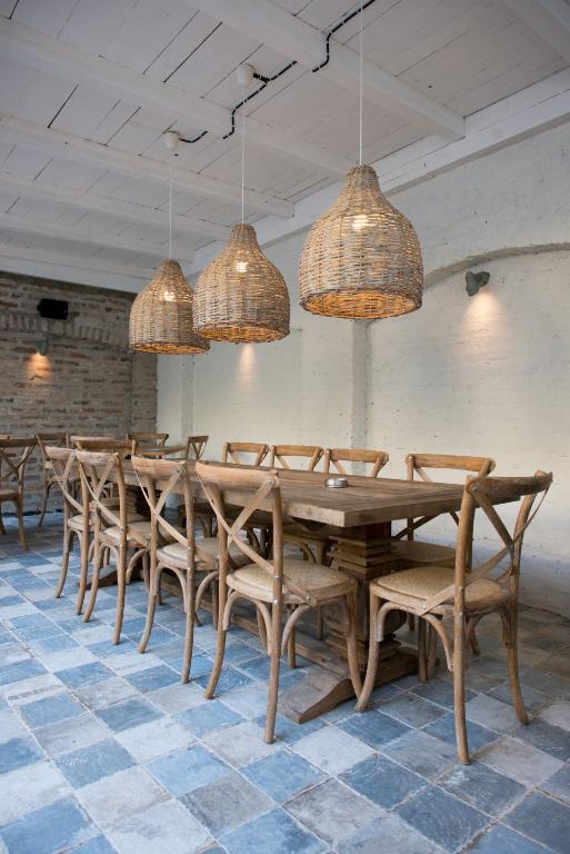 a dining room with a long table and chairs at Smokvica Dorćol B&B in Belgrade