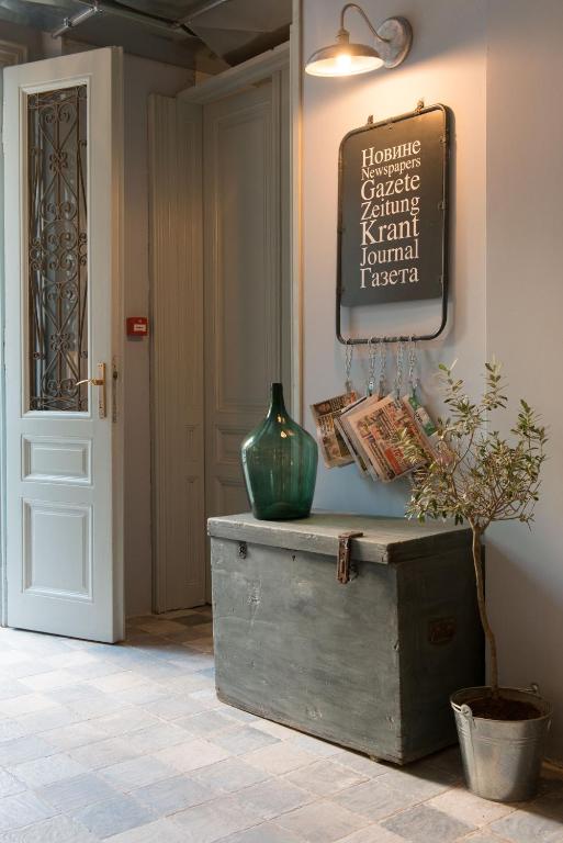 a room with a vase on top of a chest at Smokvica Dorćol B&B in Belgrade