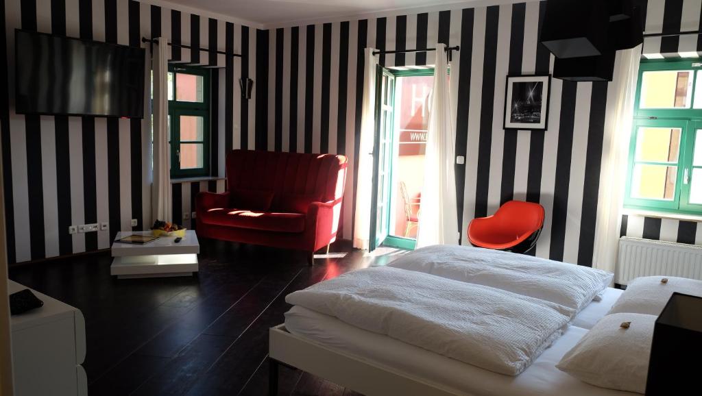 Voodi või voodid majutusasutuse Backstage Hotel toas