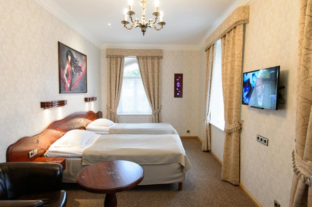 Voodi või voodid majutusasutuse Georgi Hotell toas