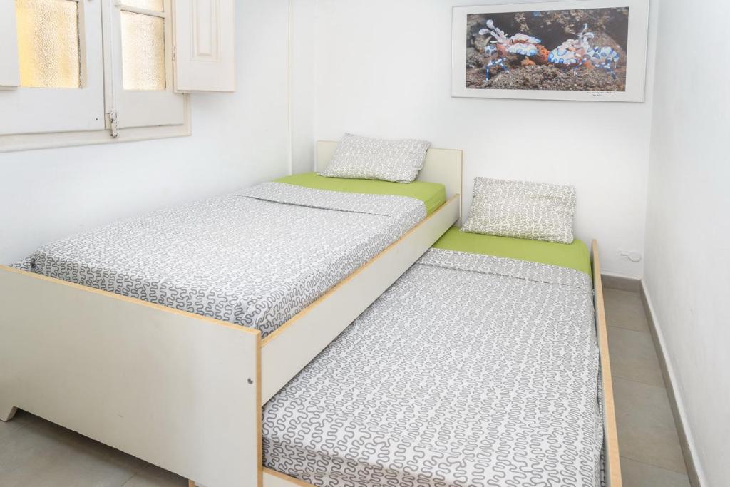 A bed or beds in a room at Private Roof Top Sant Antoni
