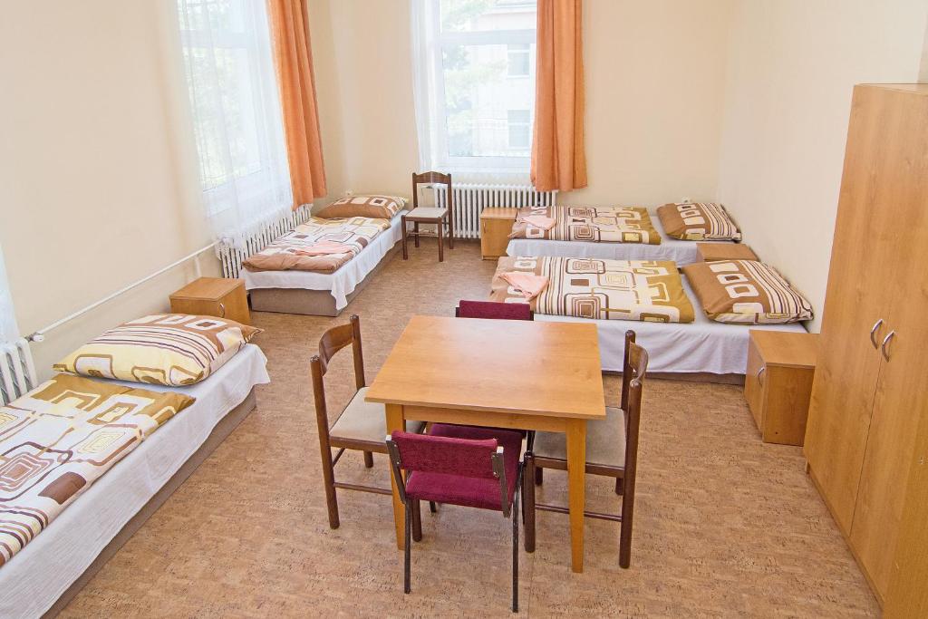Postel nebo postele na pokoji v ubytování Hotel Hůrka