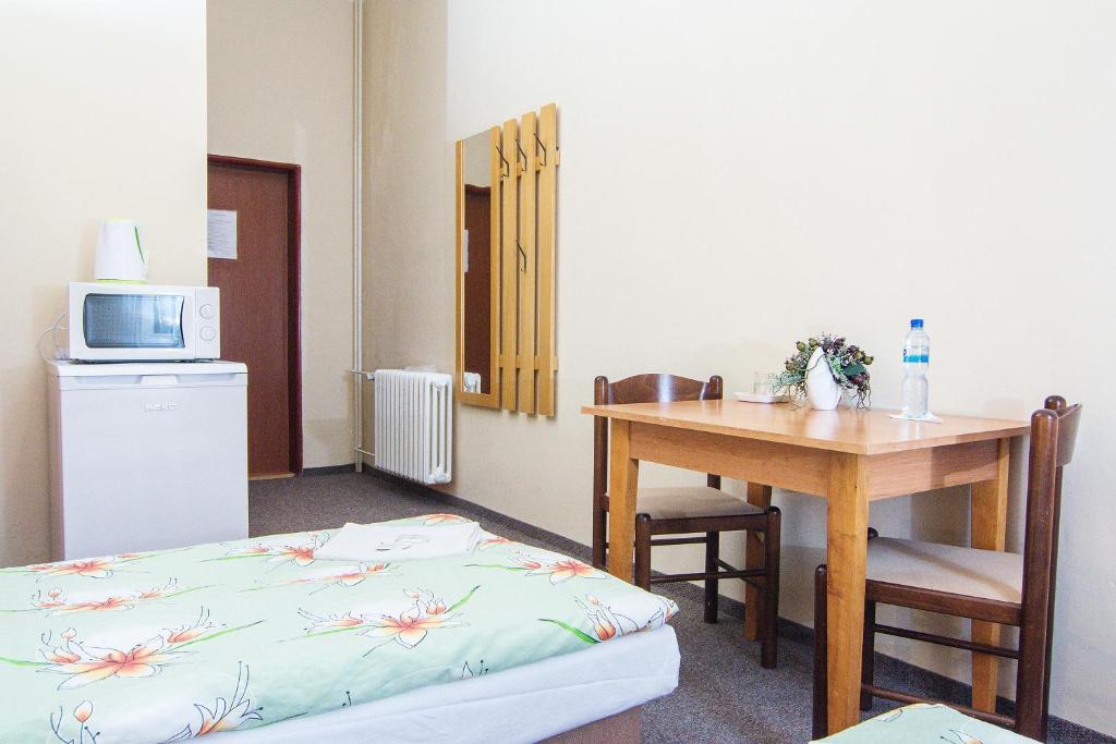 Postel nebo postele na pokoji v ubytování Hotel Hůrka