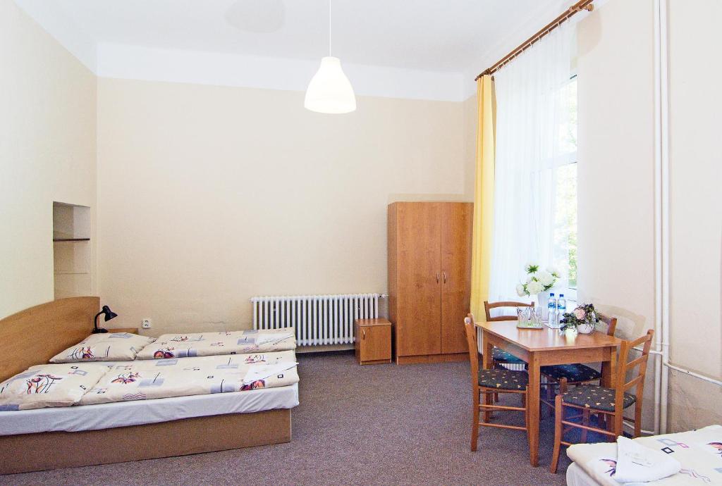Postel nebo postele na pokoji v ubytování Hotel Hůrka