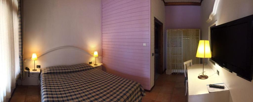 Postel nebo postele na pokoji v ubytování Motel 7 Laghi