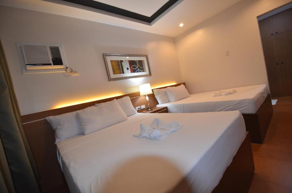 Postel nebo postele na pokoji v ubytování Robinland Vacation Home
