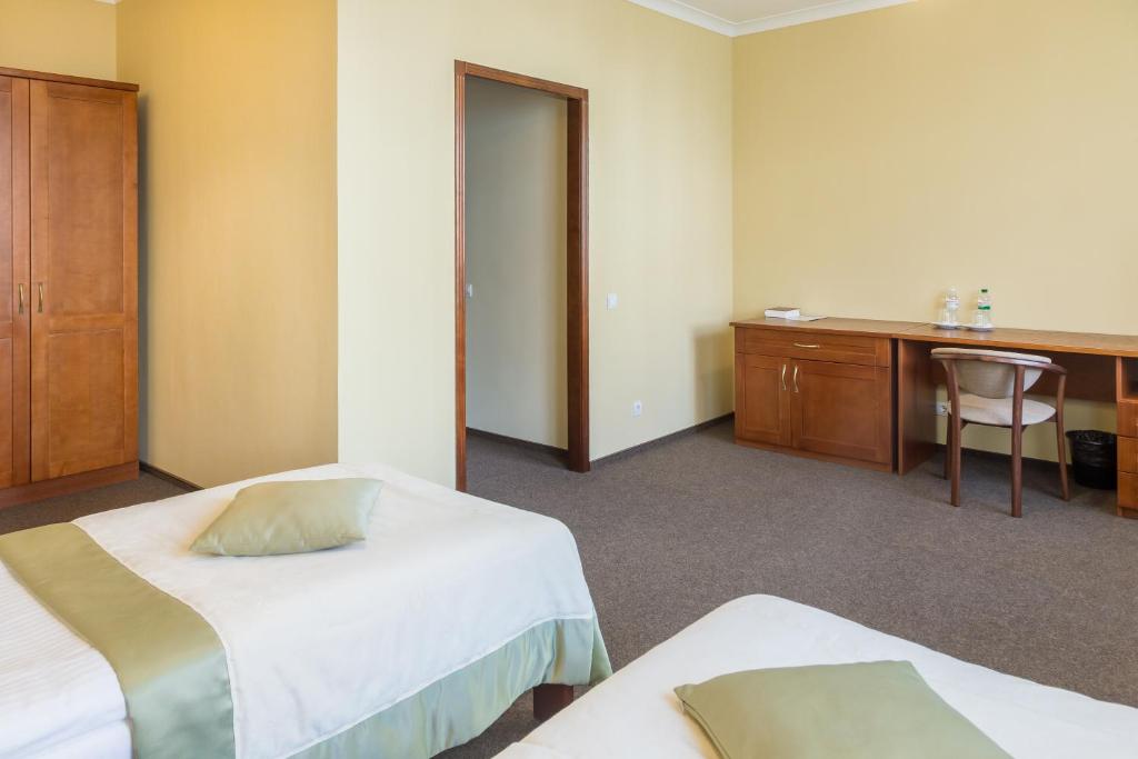Postel nebo postele na pokoji v ubytování Hotel Patriarshyi